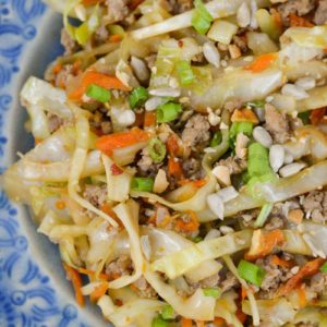Egg Roll in a Bowl is an easy, healthy dinner that is ready in under 20 minutes! This easy pork stir fry recipe is loaded with meat, vegetables and a sesame sauce.